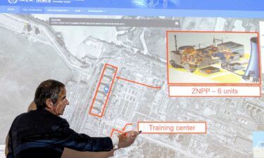 Rafael Grossi points on a map of the Zaporizhzhia nuclear power plant in March of 2022.