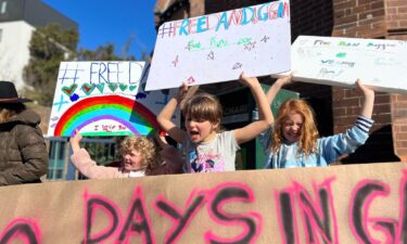 Daniel Duggan's children joined protesters on July 23 to call for their father's release.