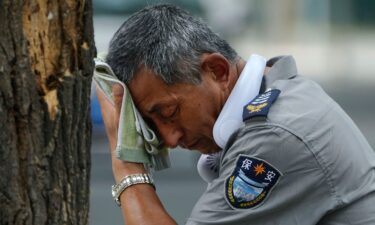 A security guard is pictured here on a hot day in Beijing