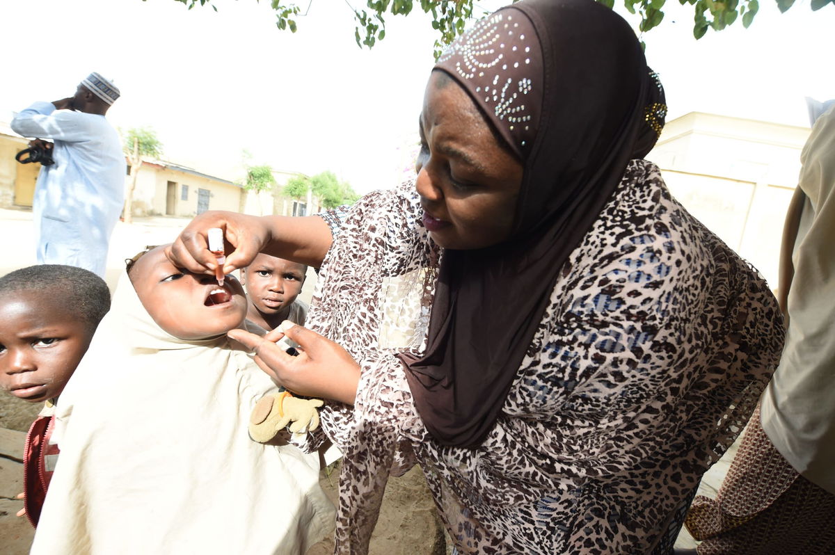 <i>Pius Utomi Ekpei/AFP/Getty Images</i><br/>A health official tries to immunize a child during a vaccination campaign in Kano