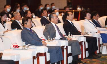 China's top diplomat Wang Yi attends the opening ceremony of the 2023 International Forum for Trilateral Cooperation in Qingdao