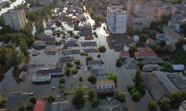 An aerial view shows flooded residential districts in the city of Kherson