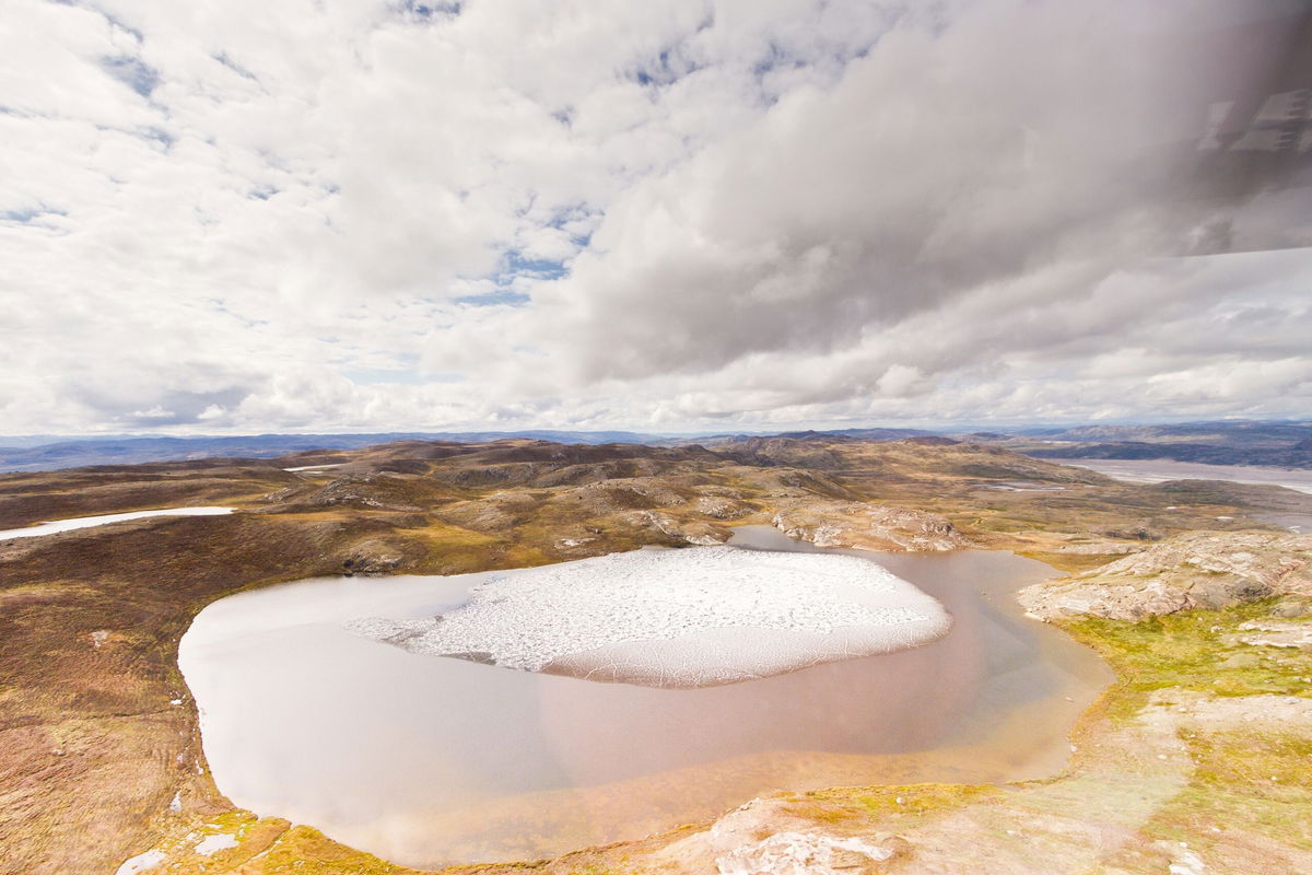 <i>Josh Brown/University of Vermont</i><br/>Melting ice on a small tundra pond in Greenland.