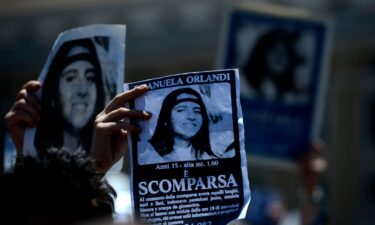 A demonstrator holds a poster of Emanuela Orlandi reading "Missing" during then-Pope Benedict XVI's Regina Coeli noon prayer in St. Peter's Square