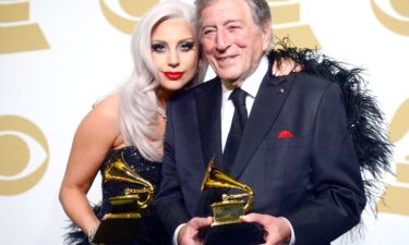 Lady Gaga and Tony Bennett pose with their Grammys for their 2014 album "Cheek to Cheek."