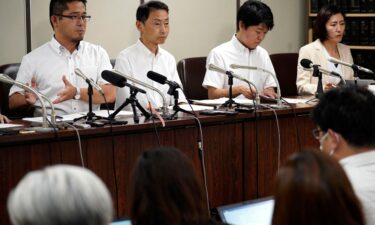 Lawyers speak during a news conference at Tokyo District Court on July 11