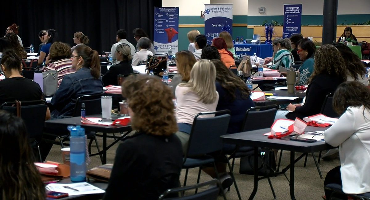 Attendees listen to the keynote speaker at the ADHD conference 