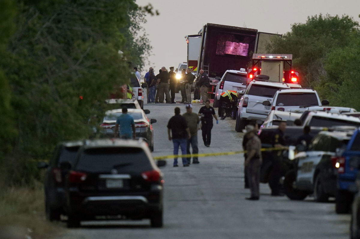 First responders at the the scene where dozens of migrants were found dead in tractor-trailer on June 27, 2022, in San Antonio.