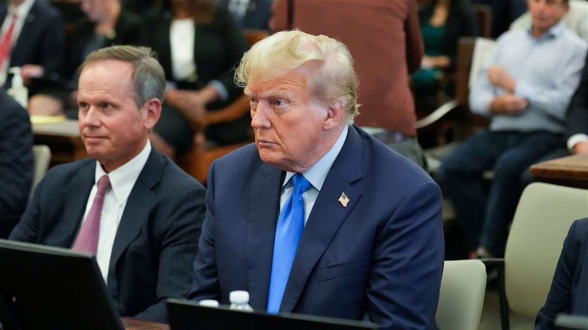 Former President Donald Trump, right, sits in the courtroom at New York Supreme Court, on October 2 in New York.