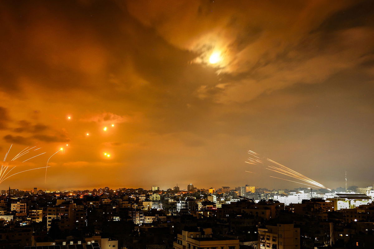 Rockets fired by Palestinian militants from Gaza City are intercepted by the Israeli Iron Dome defense missile system in the early hours of October 8.