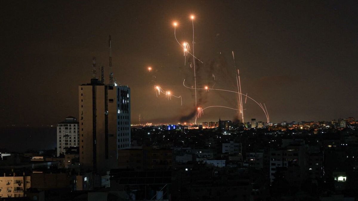 The Iron Dome defense missile system attempts to intercept rockets fired from the Gaza Strip over the city of Netivot in southern Israel on October 8.