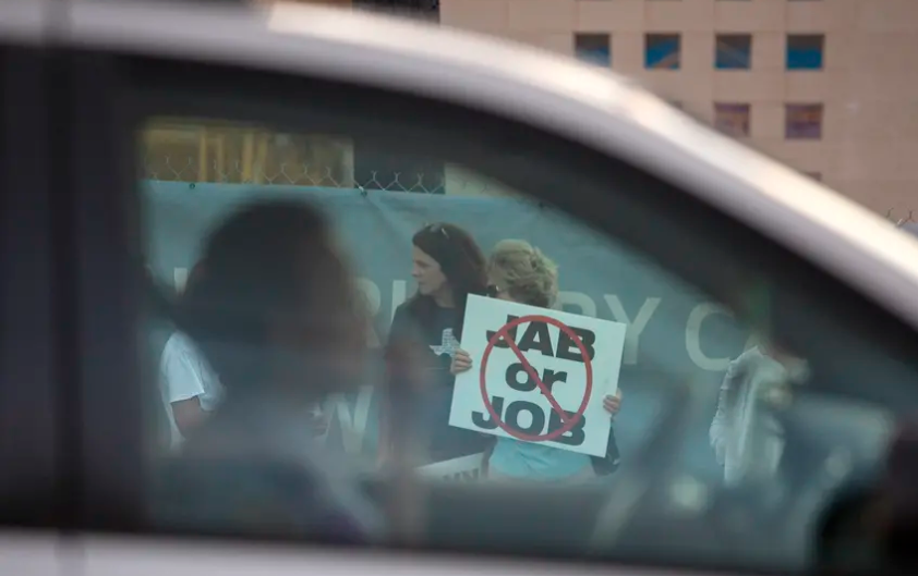 Protesters rallied against Houston Methodist Hospital's COVID-19 vaccine mandate outside the Baytown facility on June 7, 2021. The state Legislature has passed a bill that prohibits private businesses from requiring their employees to be vaccinated for COVID-19.