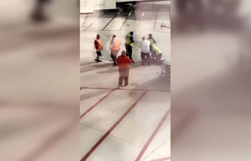 Police responded to a disturbance on plane in New Orleans when a passenger climbed on to a plane's wing at New Orleans Louis Armstrong International Airport.
