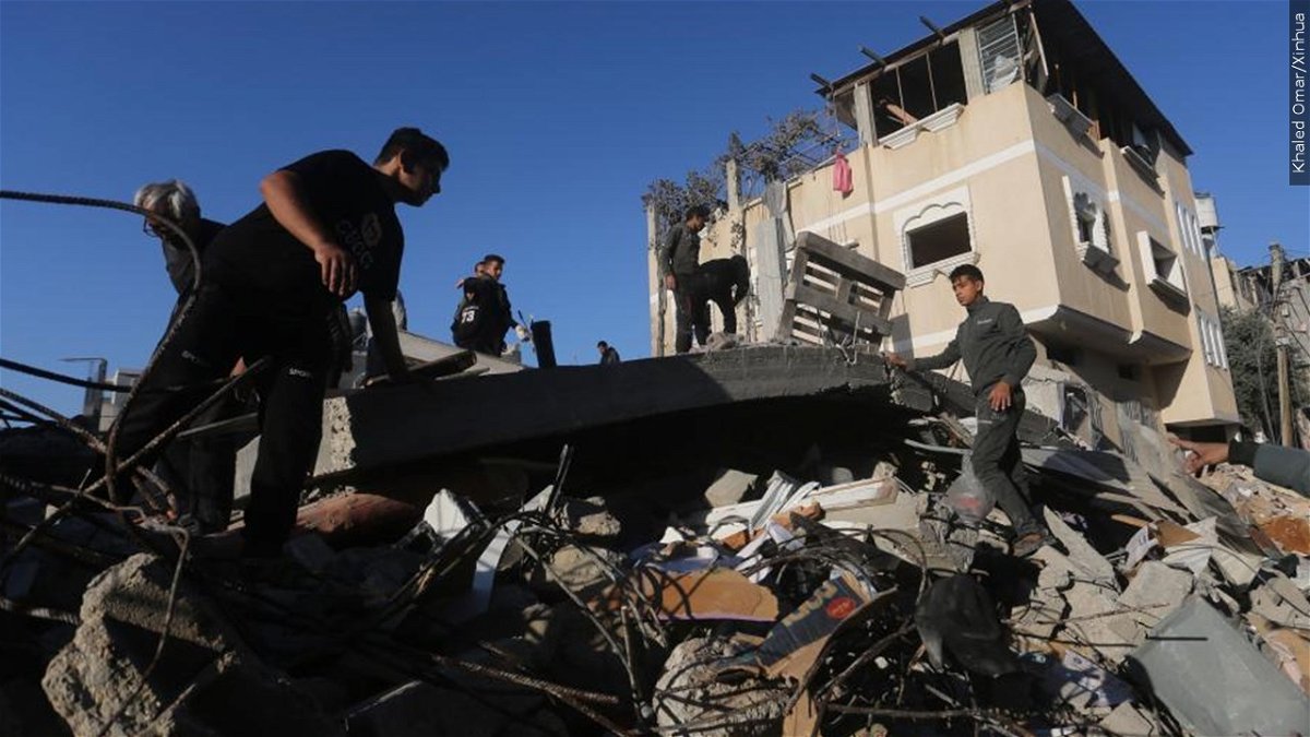 People conduct rescue work after an Israeli strike in the southern Gaza Strip city of Rafah