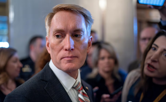 Sen. James Lankford, R-Okla., the lead GOP negotiator on a border-foreign aid package, speaks with reporters outside the chamber at the Capitol in Washington, Thursday, Jan. 25, 2024. Any bipartisan border deal could be doomed because of resistance from former President Donald Trump. 