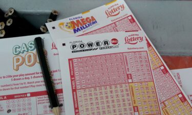 Forms to pick numbers for Powerball are on display in a store on October 4 in Miami