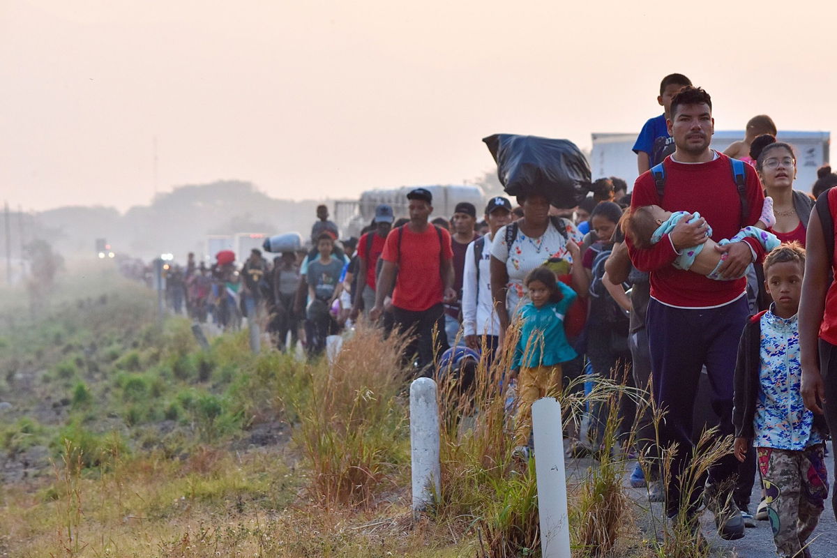 Migrants walk Monday in southern Mexico, early Monday, Jan. 8, 2024, during their journey toward the US border.