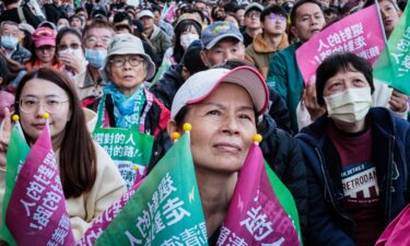 Taiwan's presidential candidate Hou Yu-ih of the main opposition Kuomintang (KMT) party bows beside his running mate Jaw Shaw-kong as they concede defeat in New Taipei City on January 13