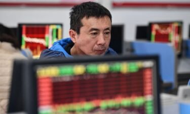 An investor monitors stock market movements at a securities company in Fuyang in China's Anhui province in January 2024.