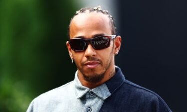 Hamilton walks the grid ahead of last year's Japanese Grand Prix.