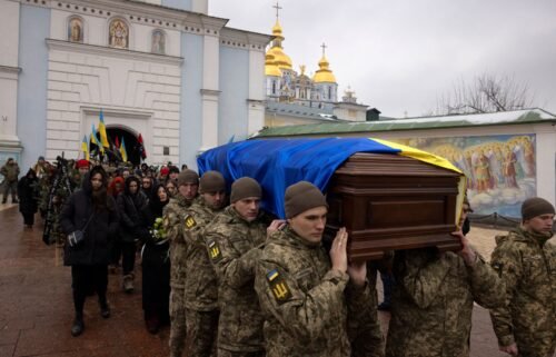 Soldiers carry the coffin of Ukrainian poet and serviceman Maksym Kryvtsov who was killed in action fighting against Russia's attack on Ukraine