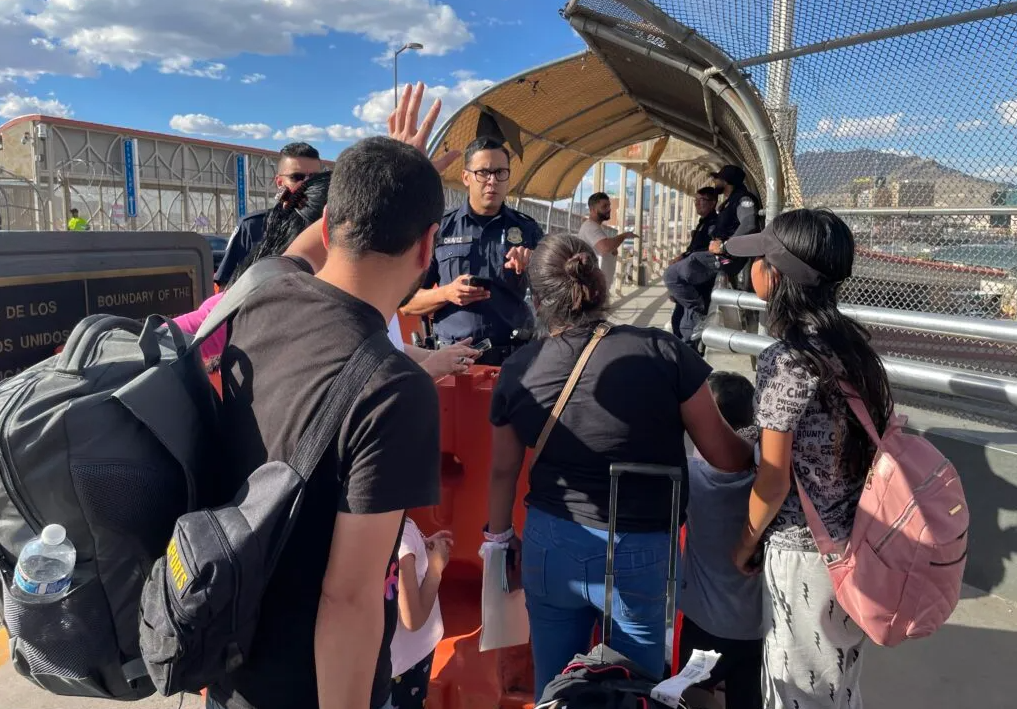 Rubbelsy, 39, a taxi driver from Guatemala, and his family enter the U.S. at the Paso Del Norte Bridge on expedited temporary humanitarian parole in October 2023. He is among the men who survived a deadly fire at a Juarez migrant detention center in March 2023. 