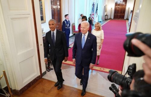 President Joe Biden and first lady Jill Biden along with former President Barack Obama and former first lady Michelle Obama arrive in the East Room of the White House in Washington
