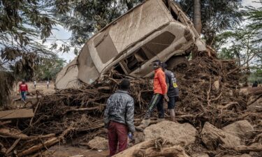 Residents gather at the river bed to search for missing people in Mai Mahiu on April 29. At least 91 people are missing after heavy flooding across Kenya’s capital