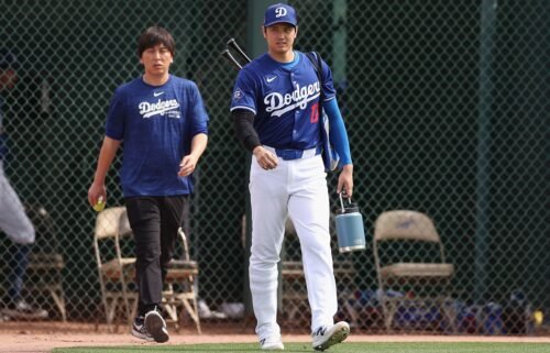 Shohei Ohtani of the Los Angeles Dodgers and his then-interpreter Ippei Mizuhara arrive to a game against the Chicago White Sox at Camelback Ranch on February 27