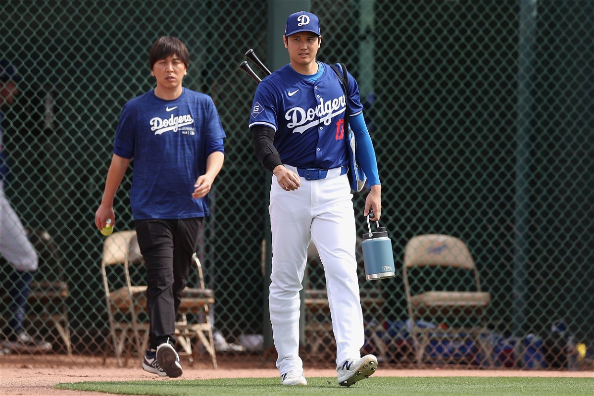 Shohei Ohtani of the Los Angeles Dodgers and his then-interpreter Ippei Mizuhara arrive to a game against the Chicago White Sox at Camelback Ranch on February 27