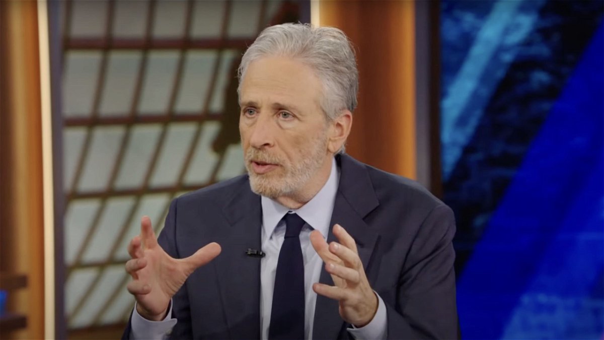 Jon Stewart is pictured in a screengrab taken from a segment of The Daily Show during his interview with Federal Trade Commission Chair Lina Khan on Monday
