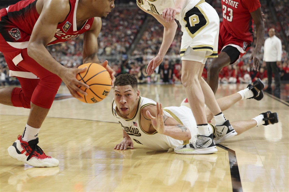 Mason Gillis dives after a loose ball in the second half of the Final Four game against North Carolina State.