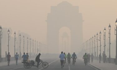 Morning walkers seen during a cold and hazy morning at Kartavya Path near India Gate on December 9