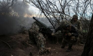 Servicemen of the 12th Special Forces Brigade Azov of the National Guard of Ukraine fire a howitzer toward Russian troops in Donetsk region