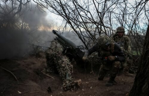 Servicemen of the 12th Special Forces Brigade Azov of the National Guard of Ukraine fire a howitzer toward Russian troops in Donetsk region