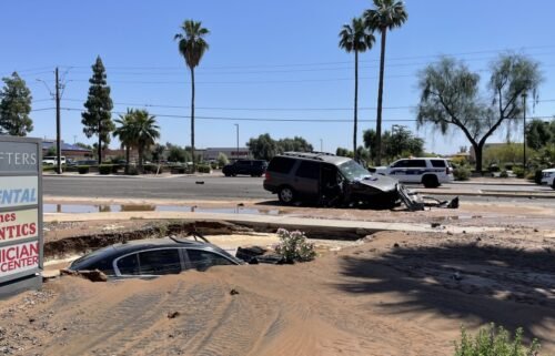 Officials are investigating a crash that led to a flooded sinkhole