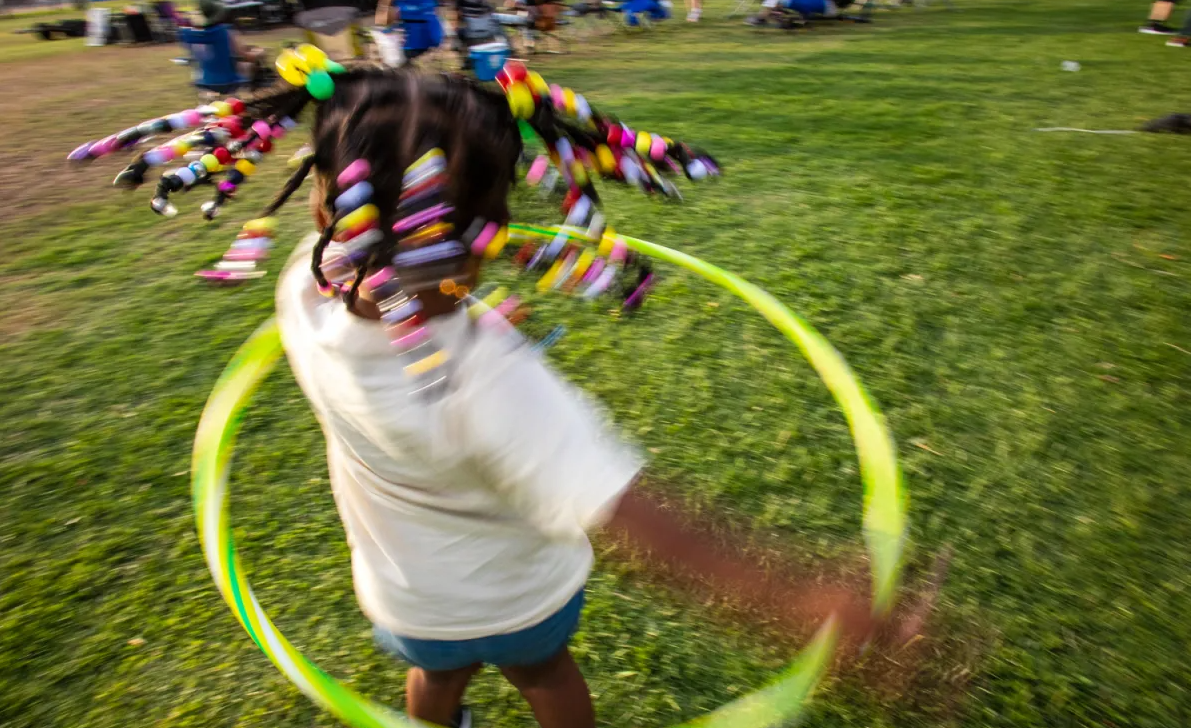 Xanobja Lamons-Norris, 3, plays with a hula hoop at Nations Tobin Park during El Paso's Juneteenth celebration on June 17, 2023.