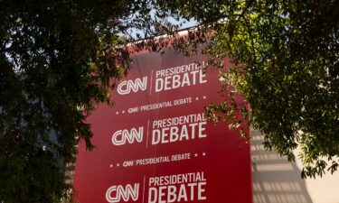 Banners hang outside of CNN’s Atlanta headquarters ahead of CNN’s Presidential Debate between President Joe Biden and former President Donald Trump on June 24.