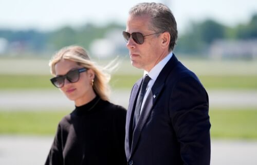 Hunter Biden walks with his wife