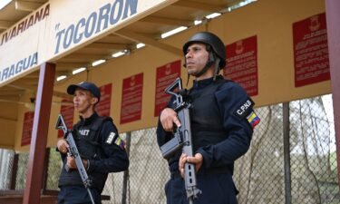 Members of the Bolivarian National Police stand guard in the Tocorón prison in Tocorón