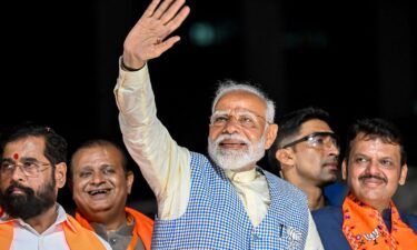 India's Prime Minister Narendra Modi waves during campaigning in Mumbai on May 15. Modi has declared victory in the national elections on June 4.