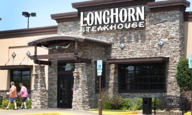 Customers leave a LongHorn Steakhouse restaurant on June 22