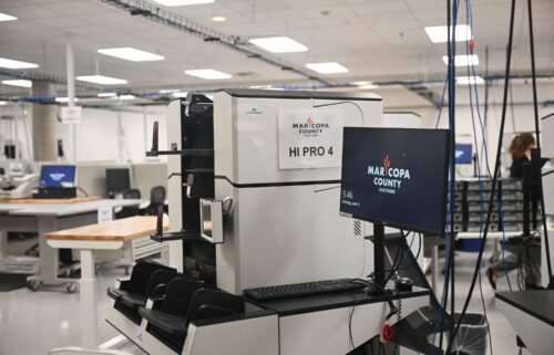 Machines for counting early ballot stand secured in the tabulation room at the Maricopa County Tabulation and Election Center in Phoenix on June 3.