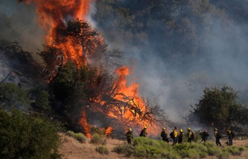 Firefighters respond to the Post Fire as it burns through the Hungry Valley State Vehicular Recreation Area in Lebec