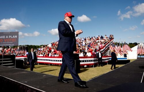 Former President Donald Trump walks off stage after speaking at a rally in Chesapeake