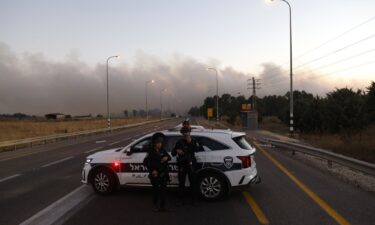 Israeli police secure a road as rockets are launched from southern Lebanon in the Israeli-annexed Golan Heights on July 9