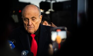 Rudy Giuliani speaks to members of the media where Republican candidate Florida Gov. Ron DeSantis was scheduled to host a campaign event on January 21