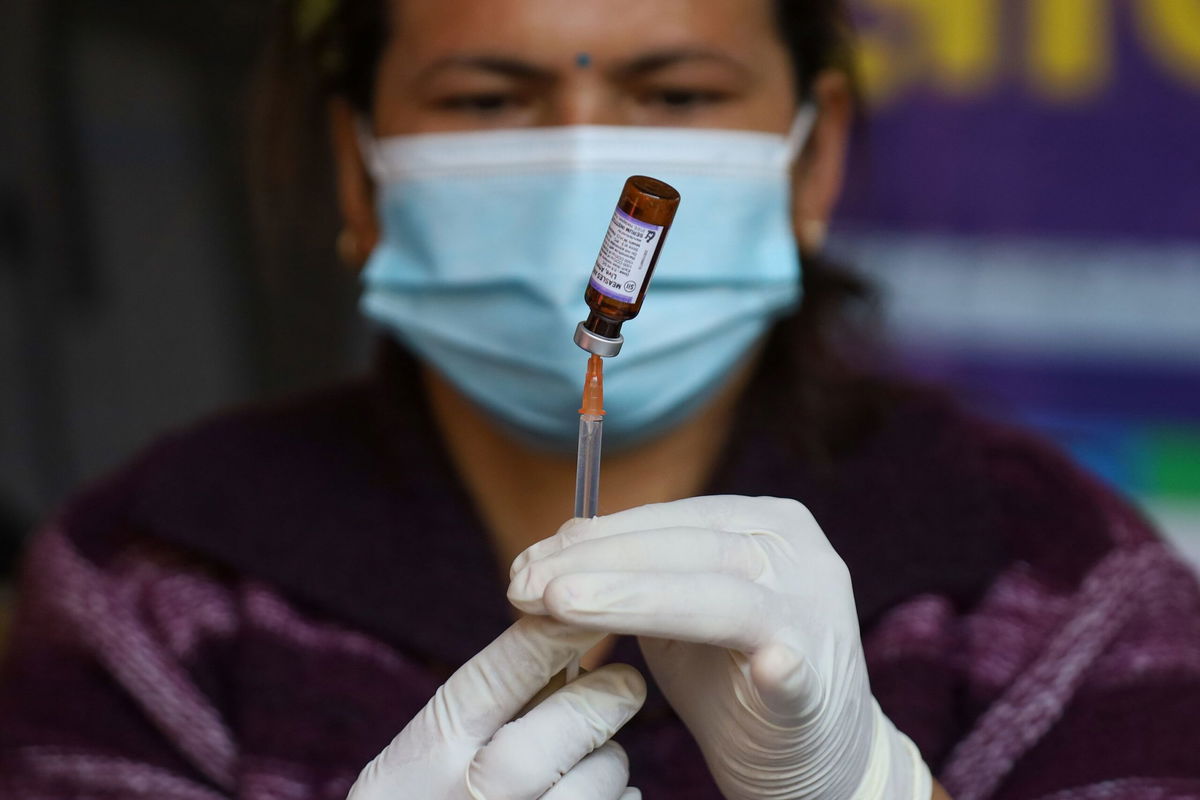 <i>Mukhtar Khan/AP via CNN Newsource</i><br/>A government health worker administers polio drops to a child in Srinagar