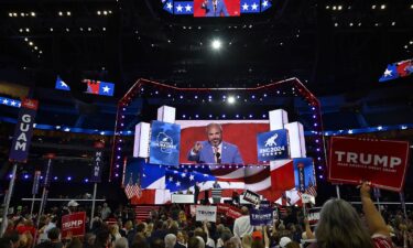 Republican delegates listen during the first day of the convention at Fiserv Forum in Milwaukee