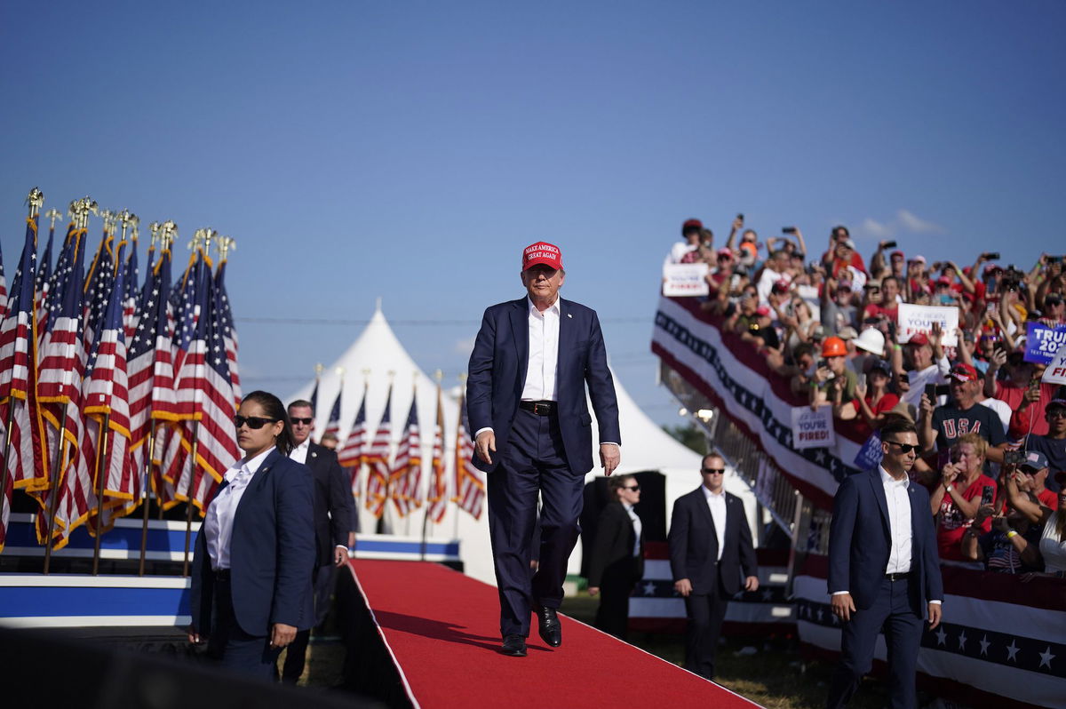 <i>Gene J. Puskar/AP via CNN Newsource</i><br/>Law enforcement snipers return fire after shots were fired while former President Donald Trump was speaking at his rally.